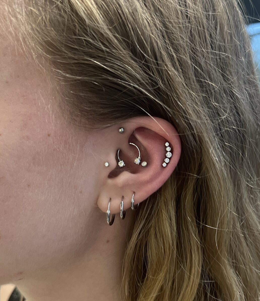 Broken Clover Tattoo, Laser, and Piercing