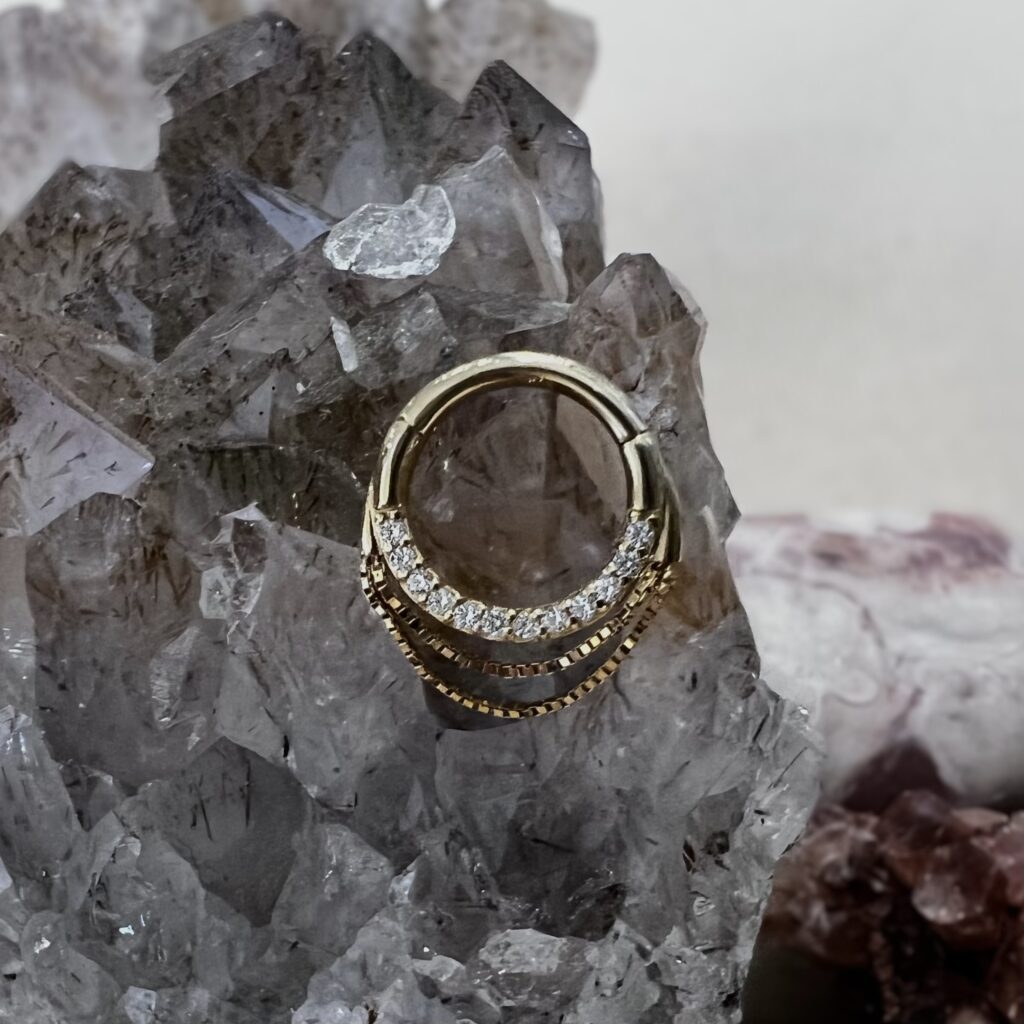 14k yellow gold clicker ring with clear CZ stones by Buddha Jewelry