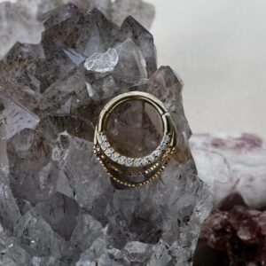 14k yellow gold clicker ring with clear CZ stones by Buddha Jewelry