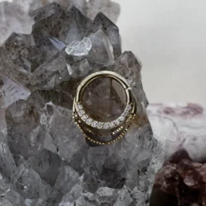 14k yellow gold clicker ring with clear CZ stones by Buddha Jewelry