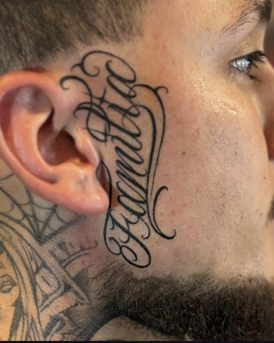 Custom Familia script face tattoo drawn by Jay at Broken Clover Tattoo