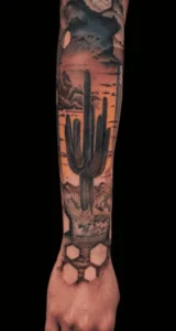 Color saguaro cactus and Arizona sunset forearm tattoo by Jinx at Broken Clover Tattoo in Tucson
