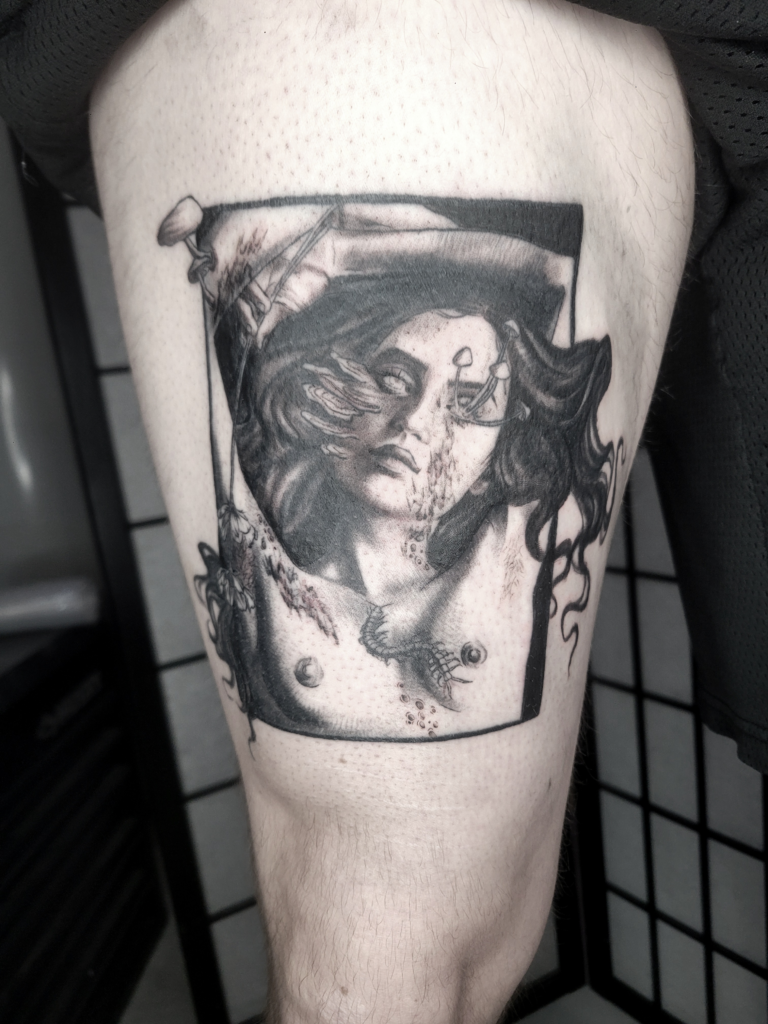 Tattoo of a woman with mushrooms growing our of her