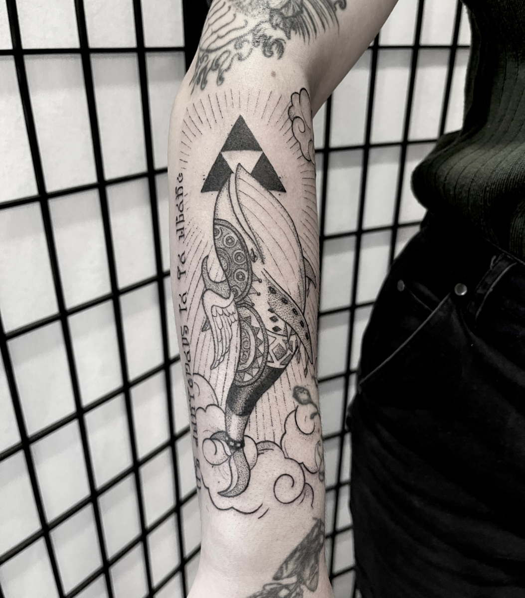 Fine line Windfish from Zelda tattoo with Triforce and Hyrulian script by Danae