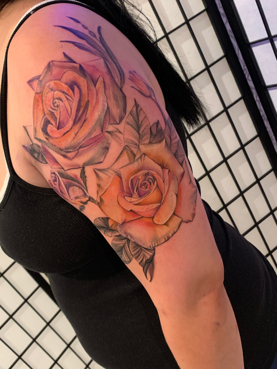 Light-colored rose tattoo by Jinx at Broken Clover Tattoo in Tucson