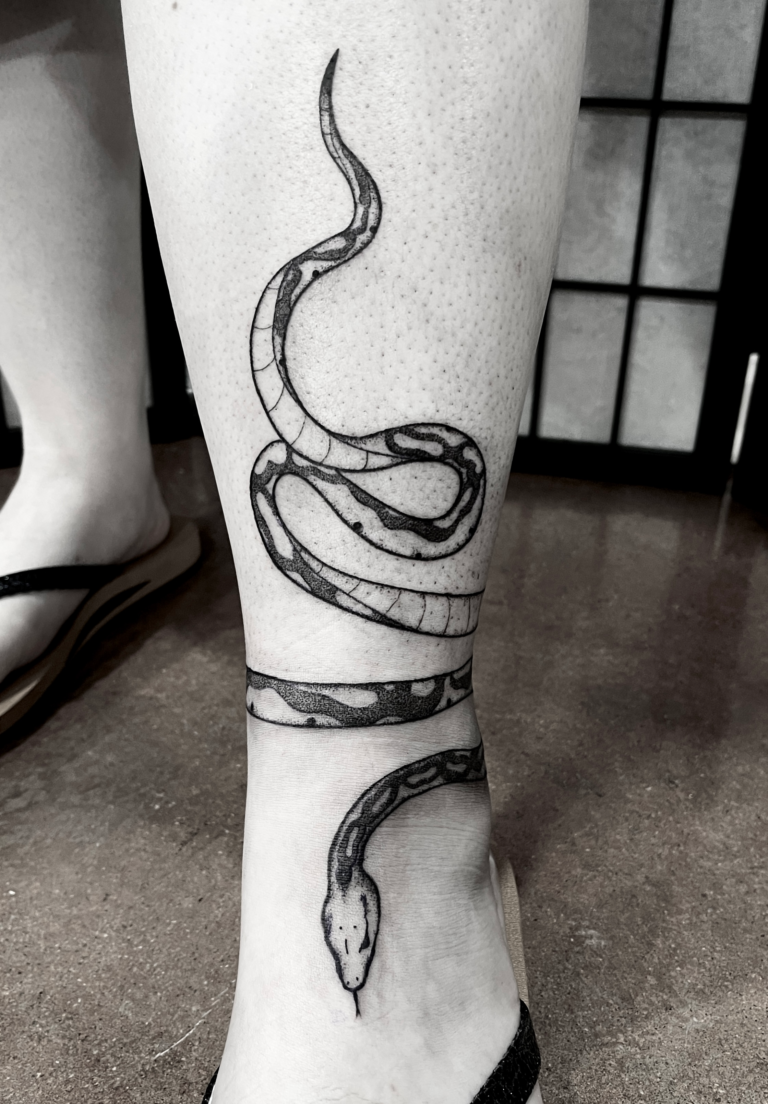 Wraparound snake tattoo