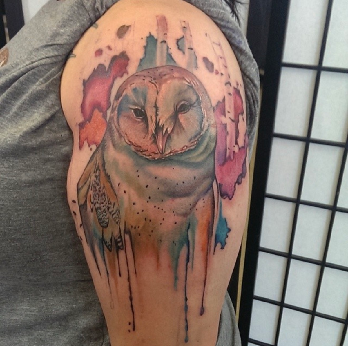 Watercolor-style owl tattoo with dripping painterly color by Jinx at Broken Clover Tattoo in Tucson