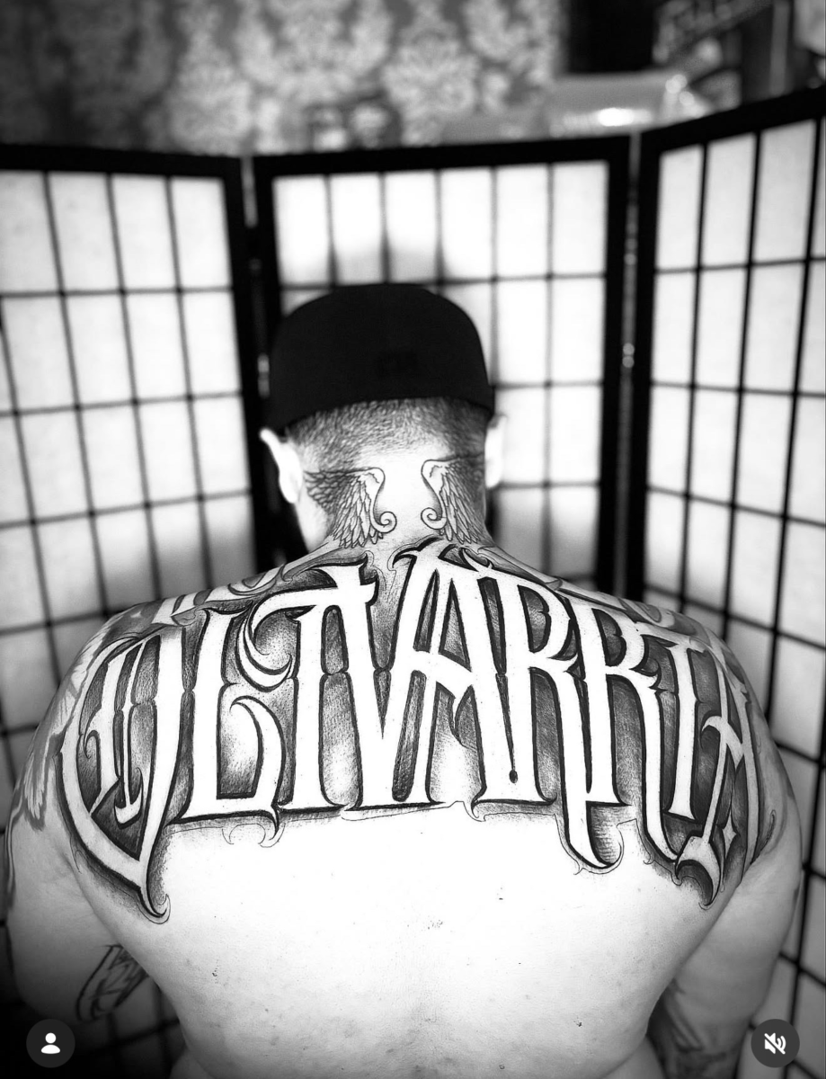 Large-scale black-and-grey back lettering tattoo by Jay at Broken Clover Tattoo in Tucson